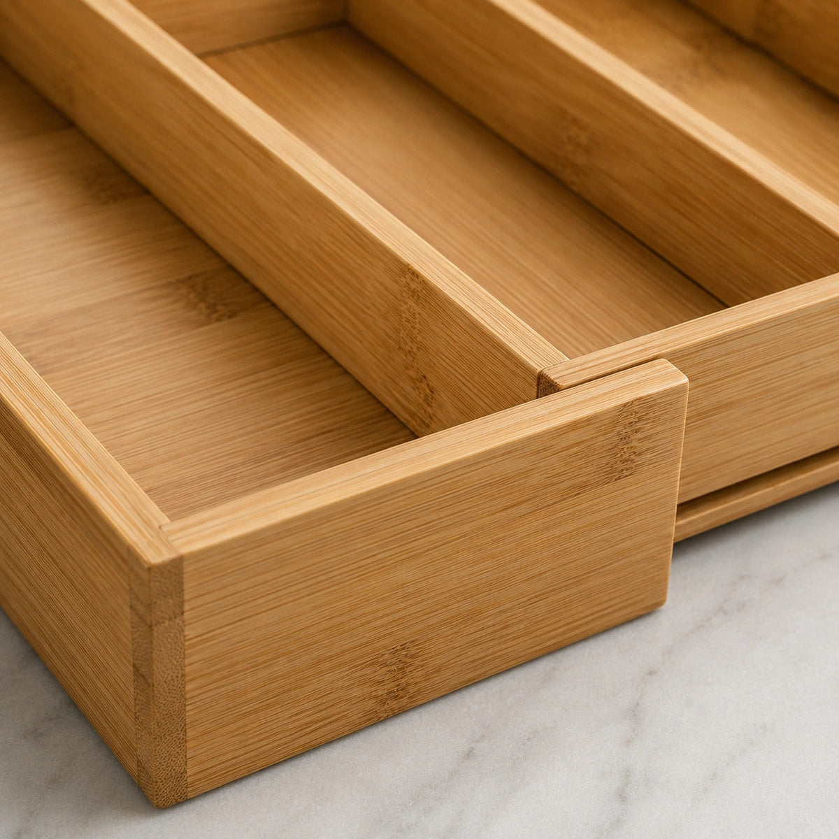 Anyorel expandable bamboo cutlery drawer organiser with multiple compartments in natural finish for kitchen storage.